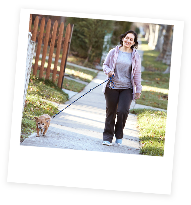 Aimovig® patient, Pooja, walking her dog